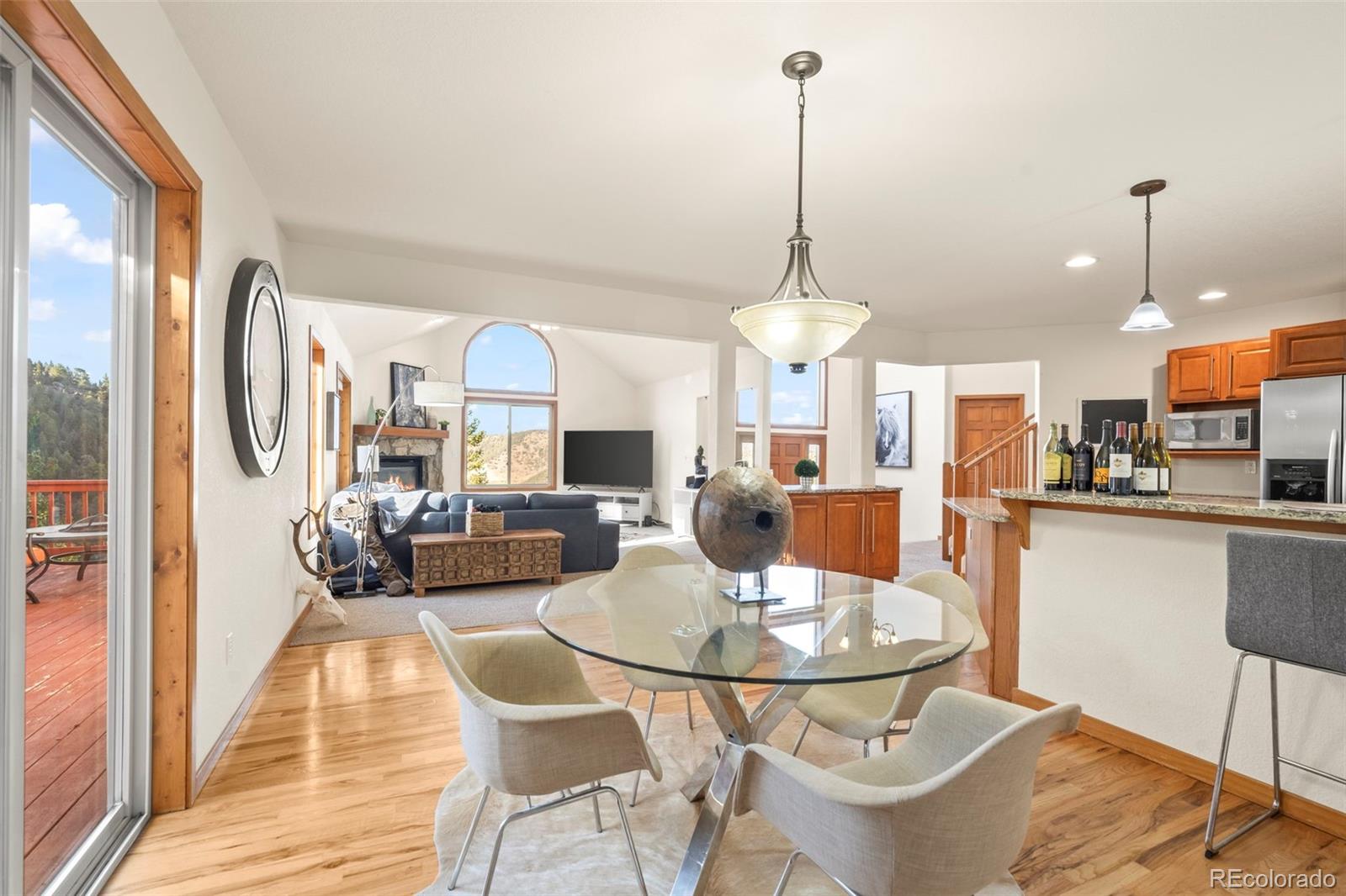 900 Sawmill Creek Road Evergreen, CO 80439 - Photo 23 of 50 a view of a dining room with furniture window and outside view