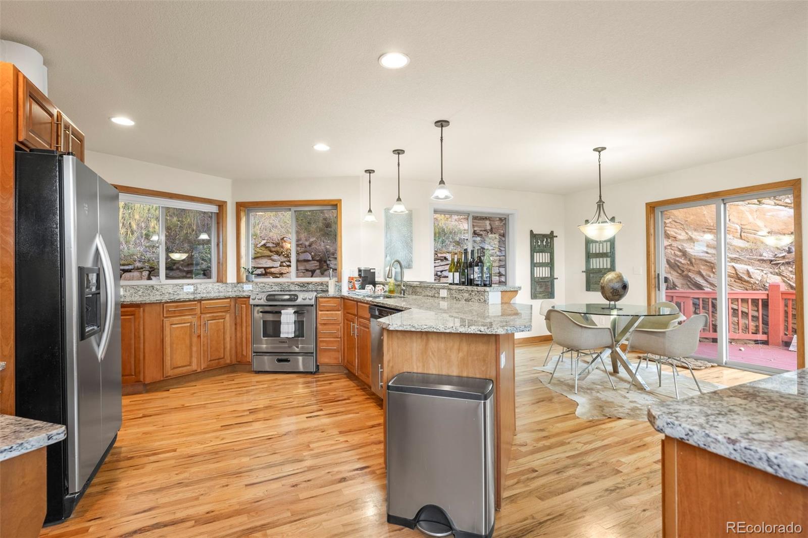 900 Sawmill Creek Road Evergreen, CO 80439 - Photo 25 of 50 a large kitchen with lots of counter space and glass windows