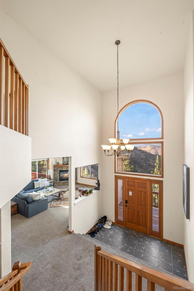 900 Sawmill Creek Road Evergreen, CO 80439 - Photo 40 of 50 a kitchen with refrigerator and cabinets