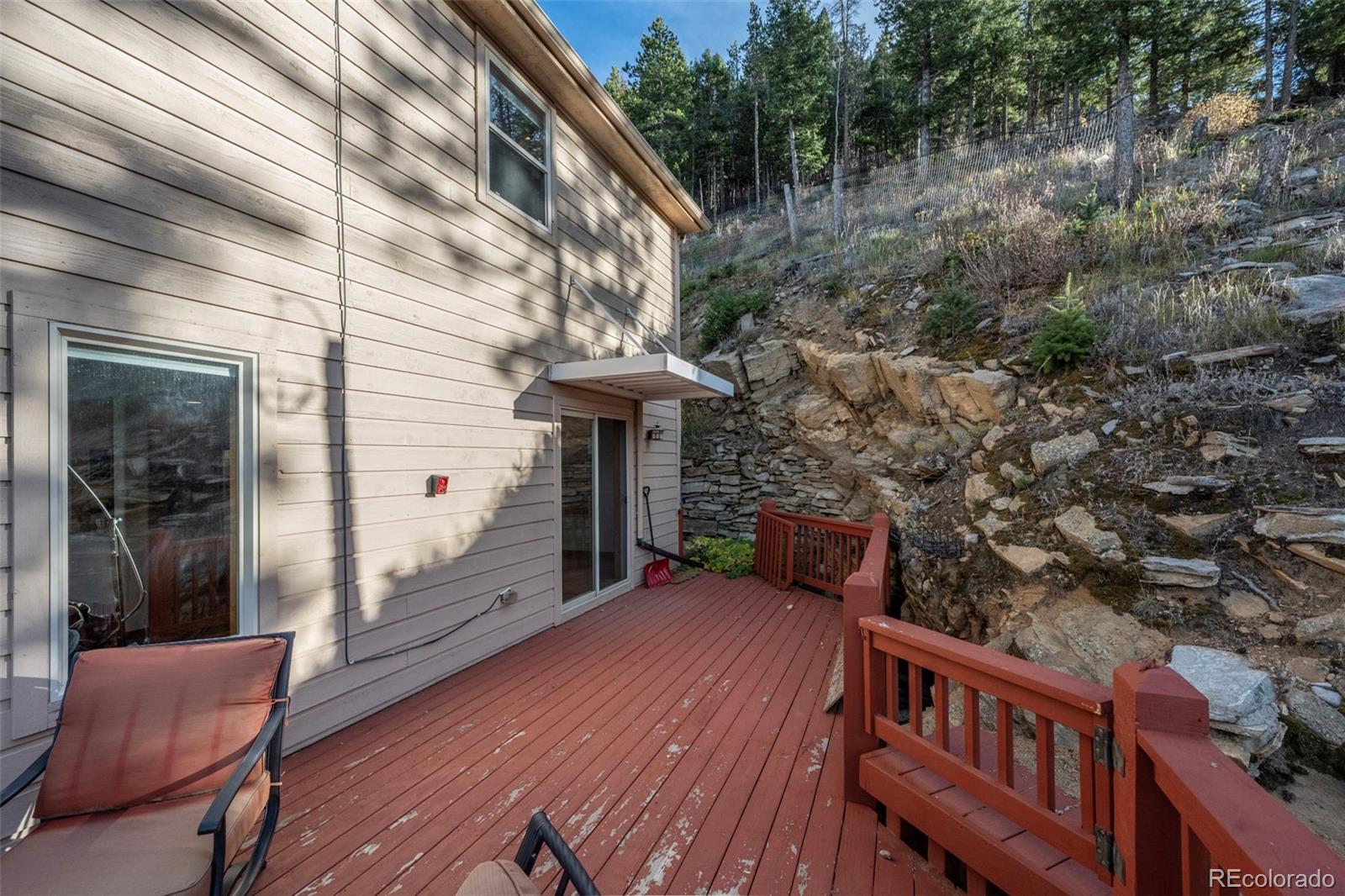 900 Sawmill Creek Road Evergreen, CO 80439 - Photo 9 of 50 a view of a deck with furniture