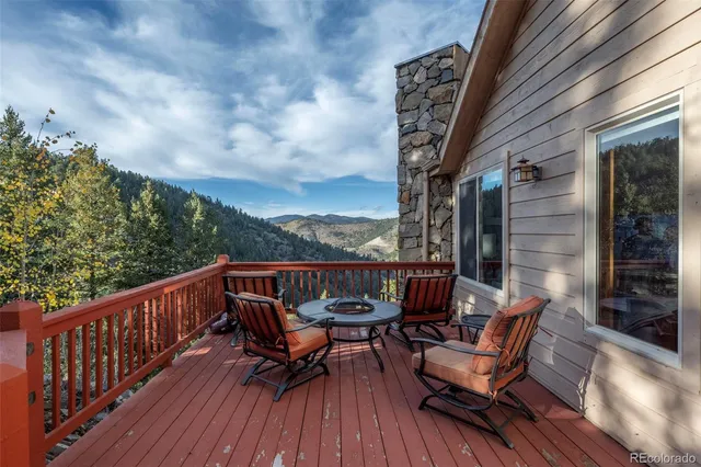 a view of a balcony with furniture