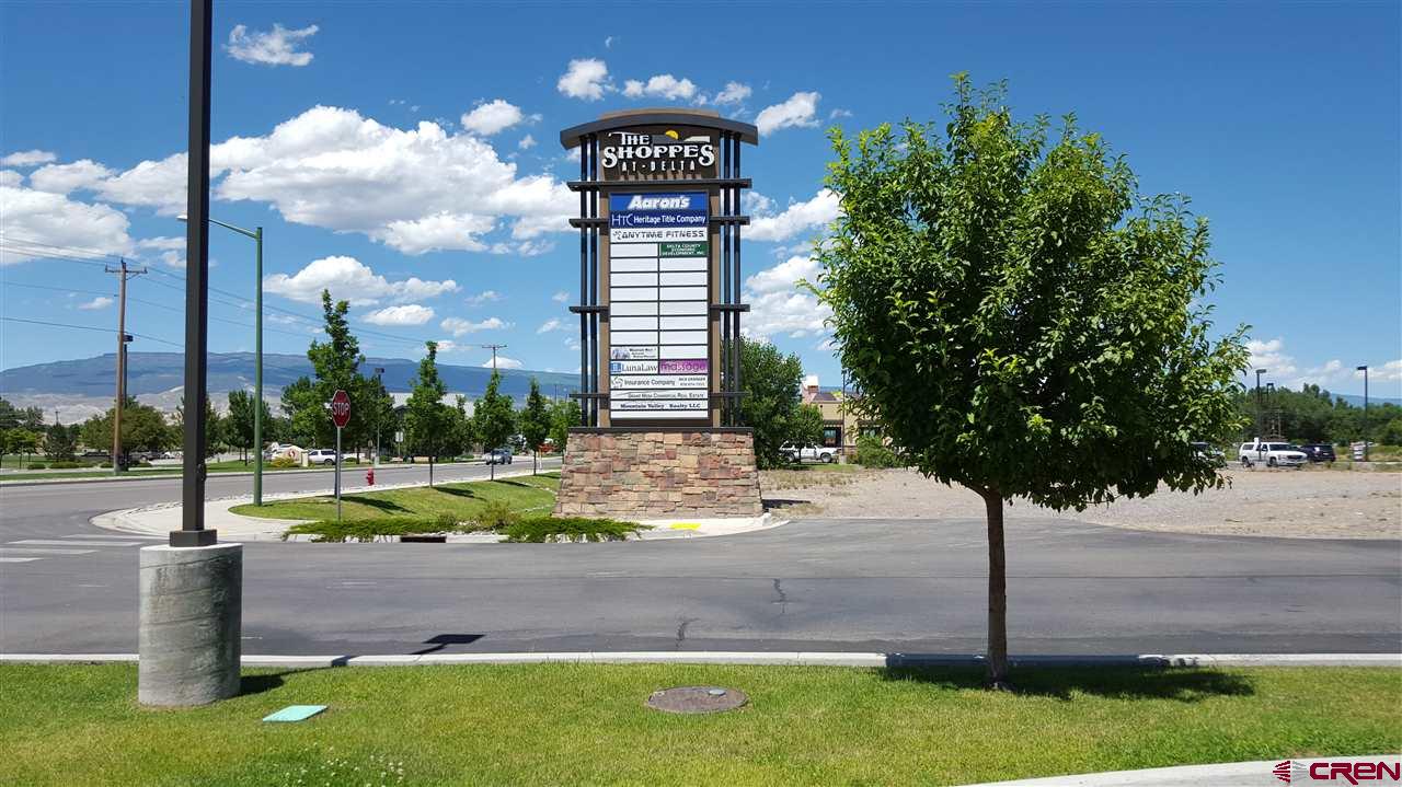 300 Stafford Lane, Unit 30212 Delta, CO 81416 - Photo 6 of 7 a sign board with a yard and lake view