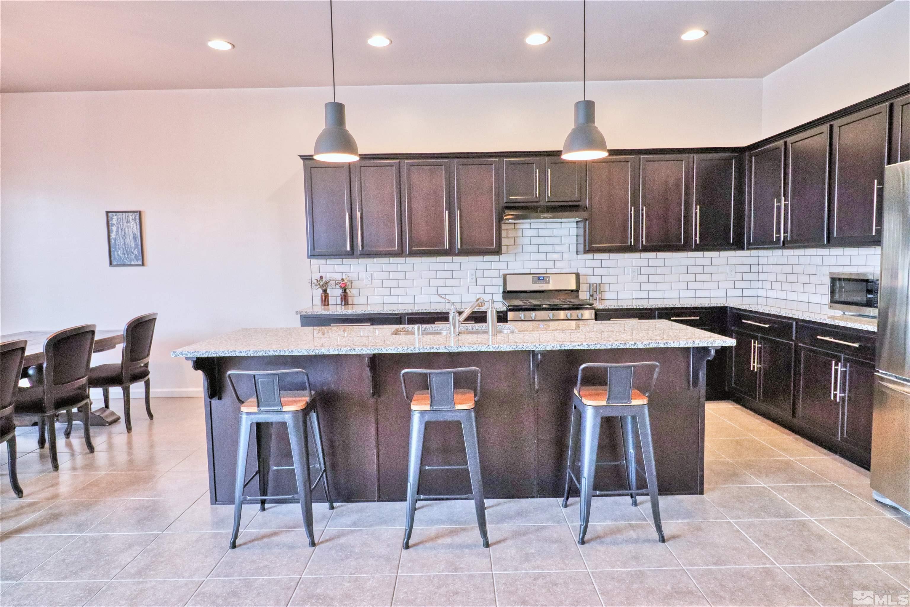 2790 Bonfire Lane Reno, NV 89521 - Photo 12 of 37 a kitchen with a sink cabinets and window