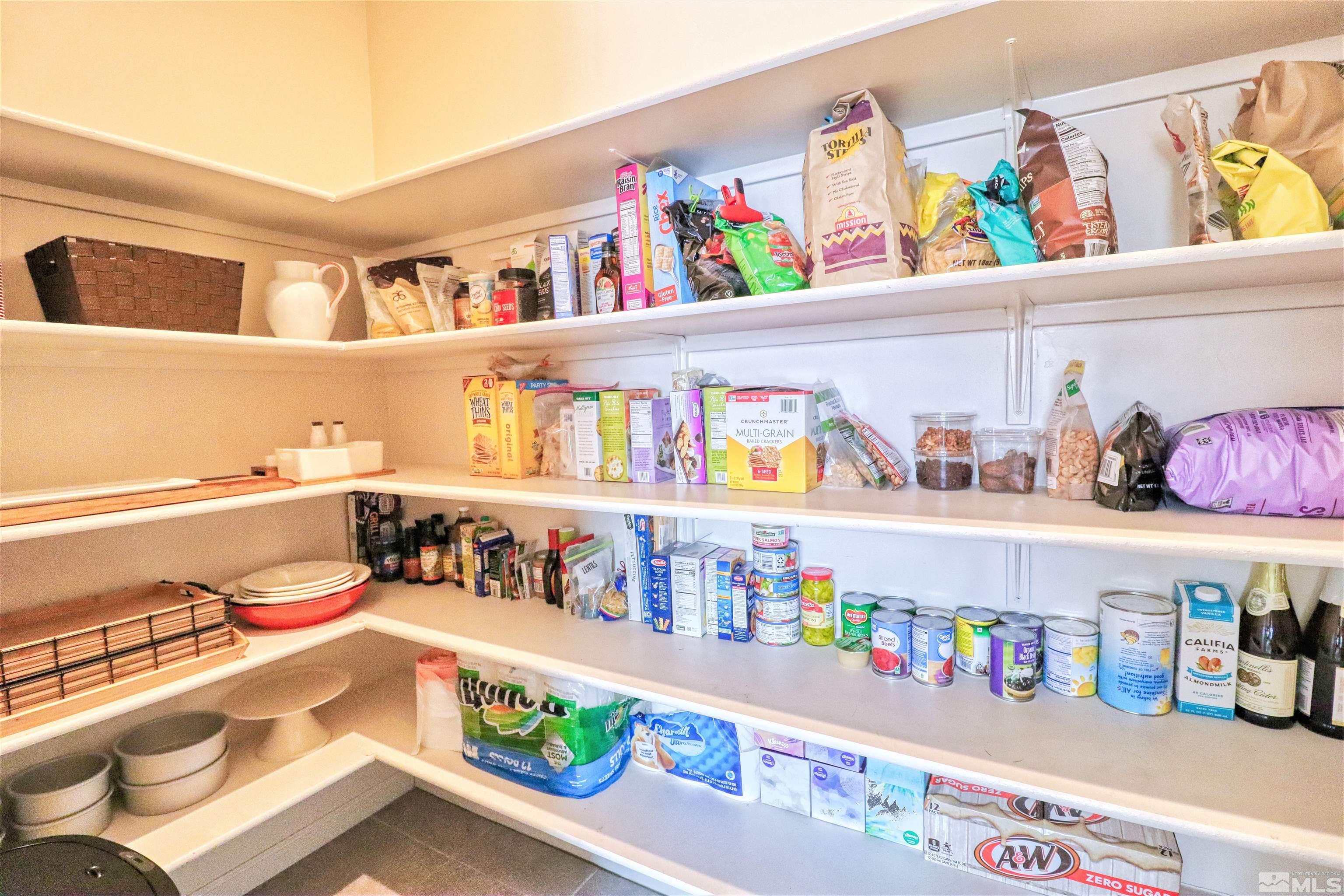 2790 Bonfire Lane Reno, NV 89521 - Photo 15 of 37 a cabinet with fridge and lots of clutter