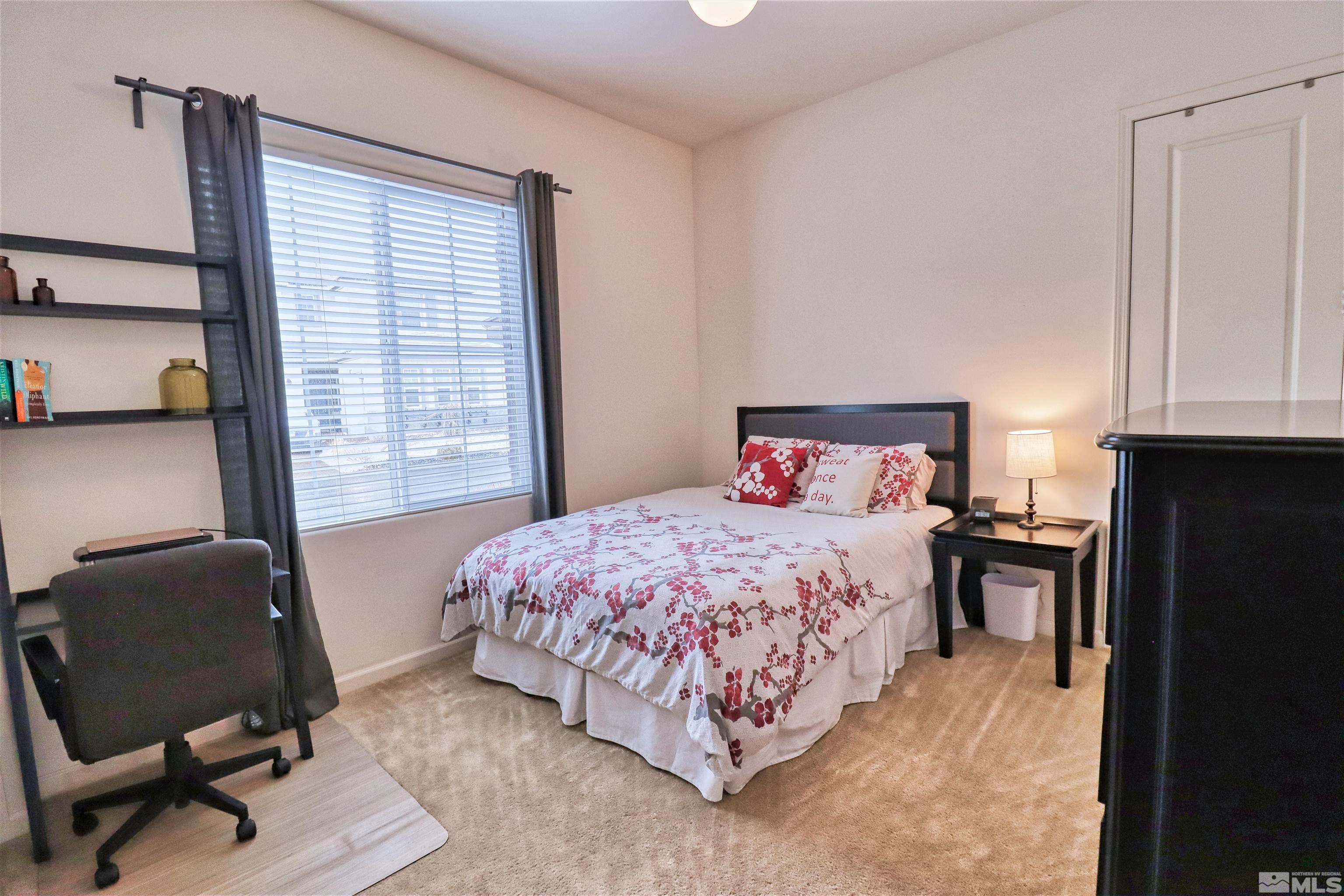 2790 Bonfire Lane Reno, NV 89521 - Photo 23 of 37 a bedroom with a bed chair and a window