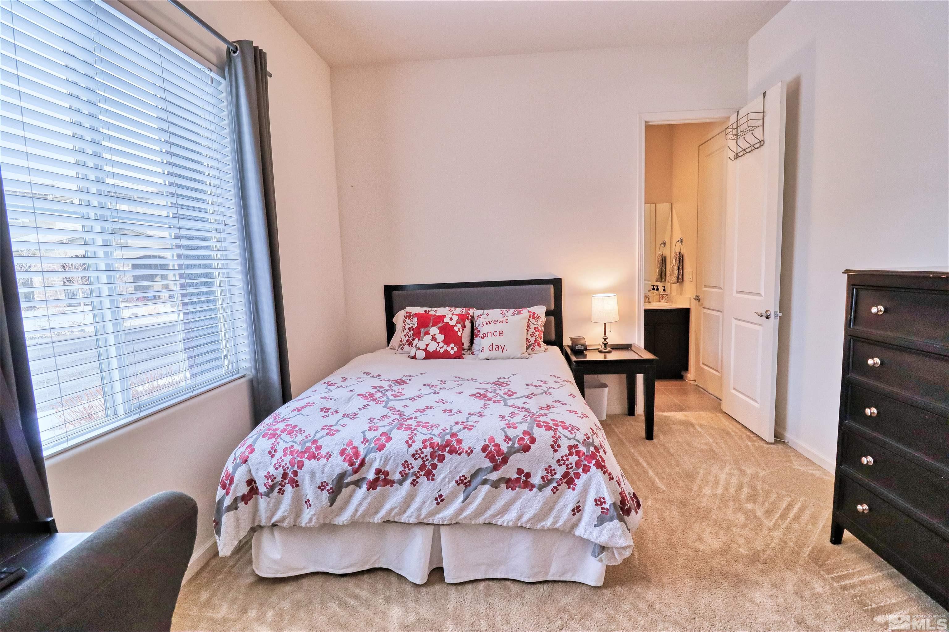 2790 Bonfire Lane Reno, NV 89521 - Photo 24 of 37 a bedroom with a bed and wooden floor