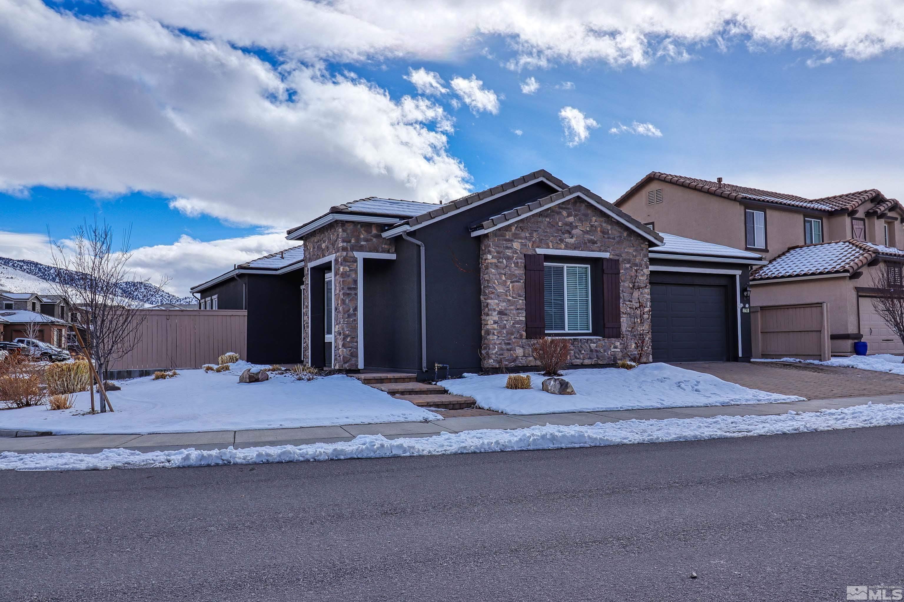 2790 Bonfire Lane Reno, NV 89521 - Photo 3 of 37 a front view of a house with a yard