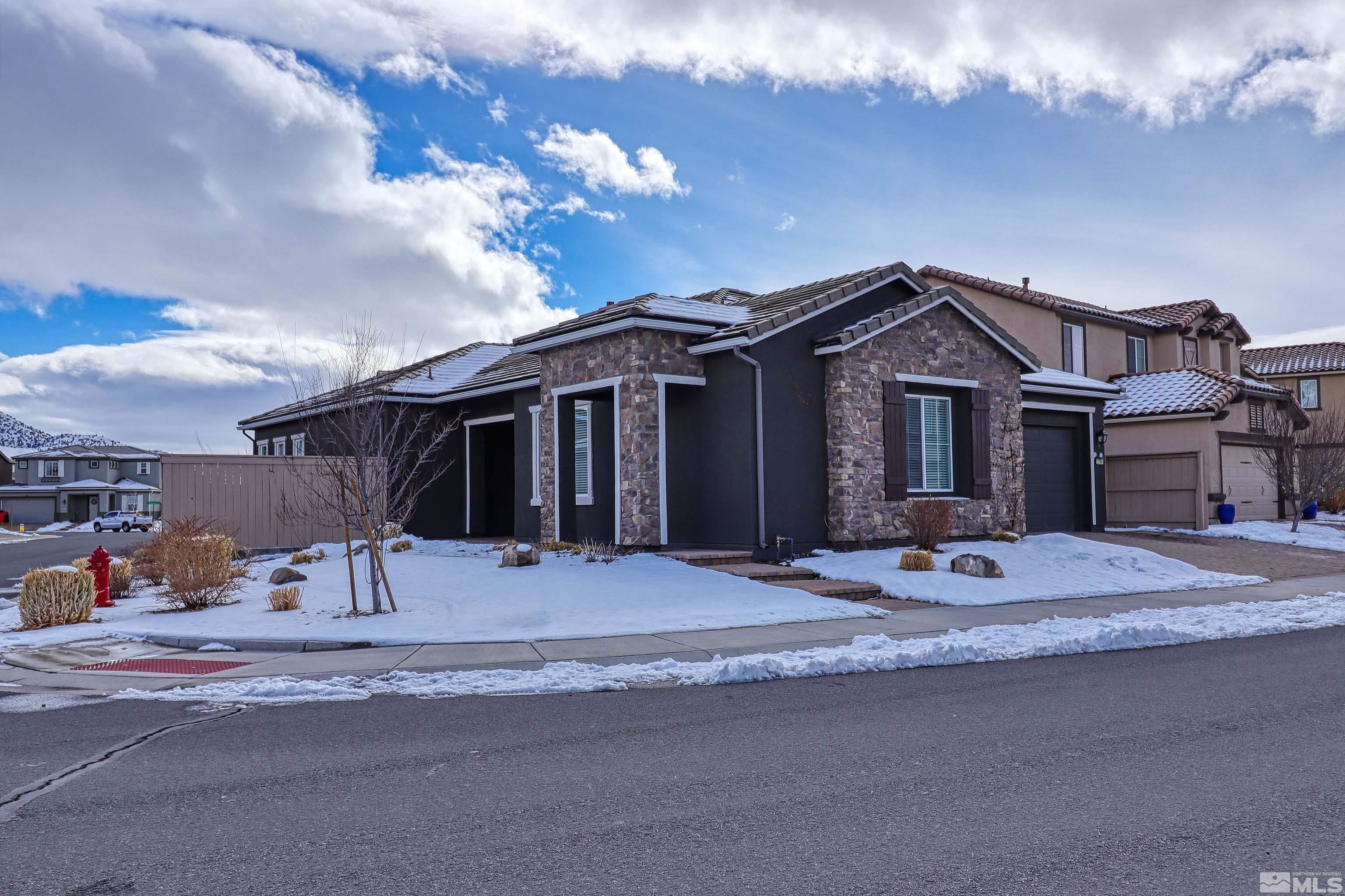 2790 Bonfire Lane Reno, NV 89521 - Photo 4 of 37 a front view of a house with a garden