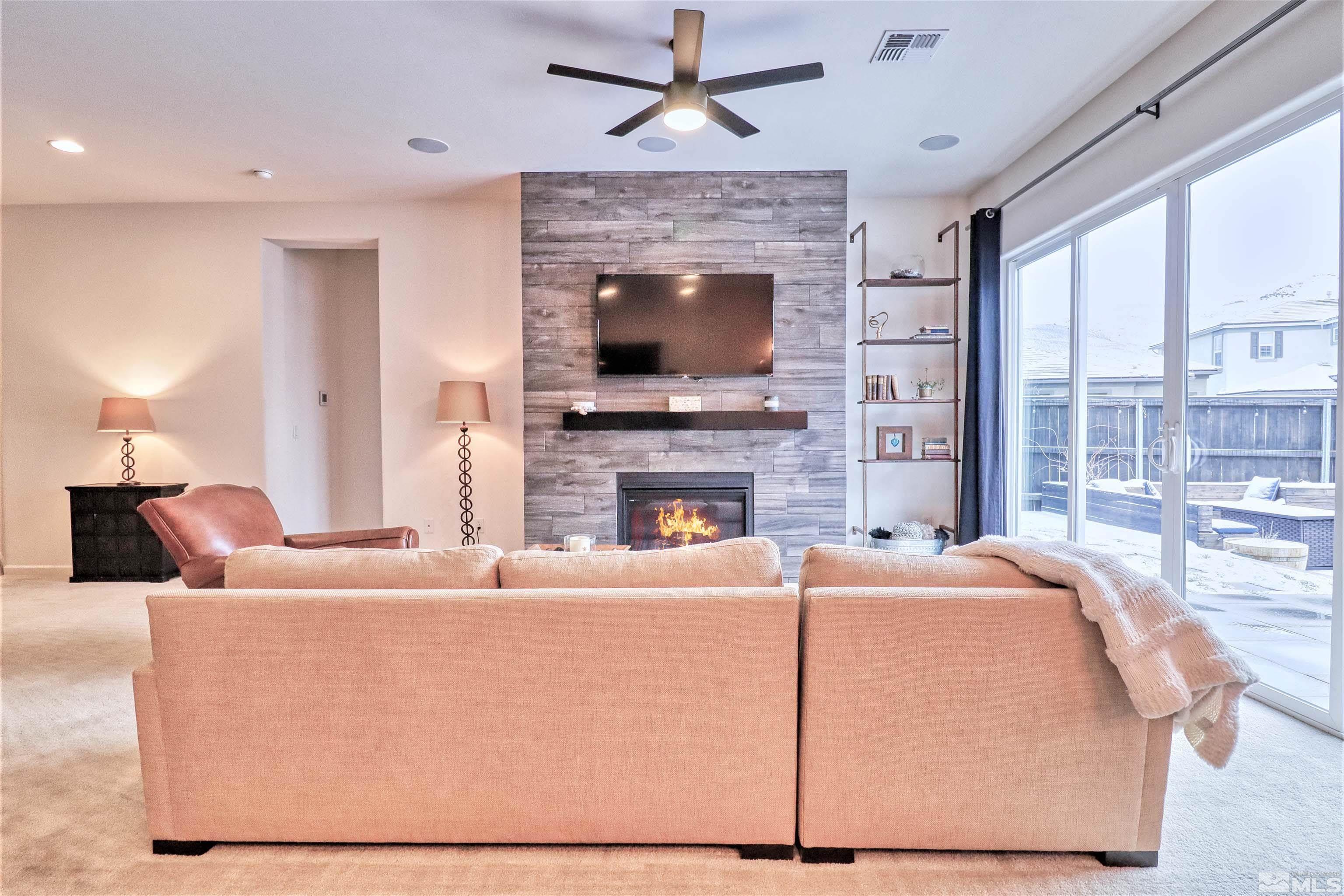 2790 Bonfire Lane Reno, NV 89521 - Photo 7 of 37 a living room with fireplace furniture and a flat screen tv