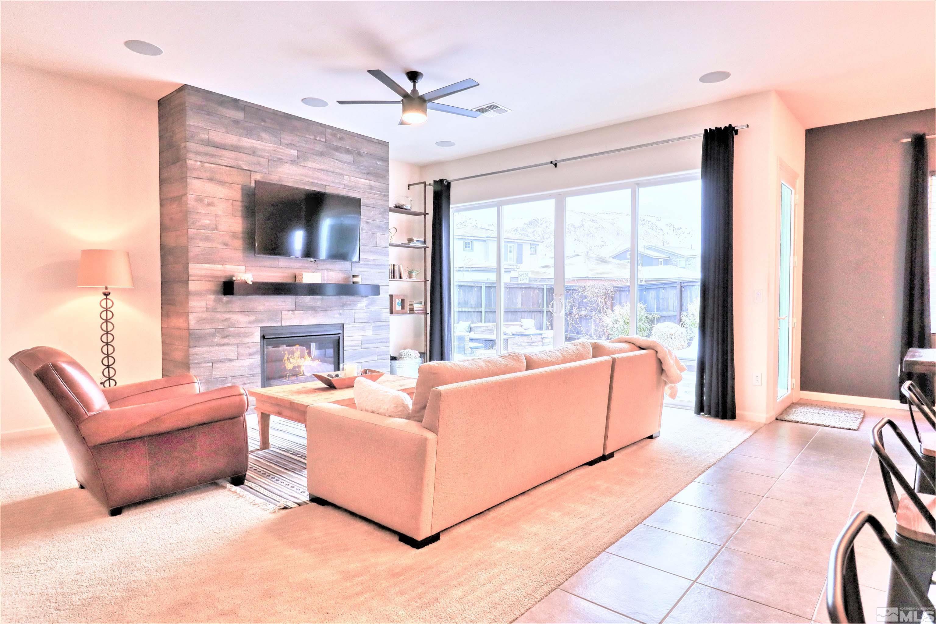 2790 Bonfire Lane Reno, NV 89521 - Photo 8 of 37 a living room with fireplace furniture and a flat screen tv