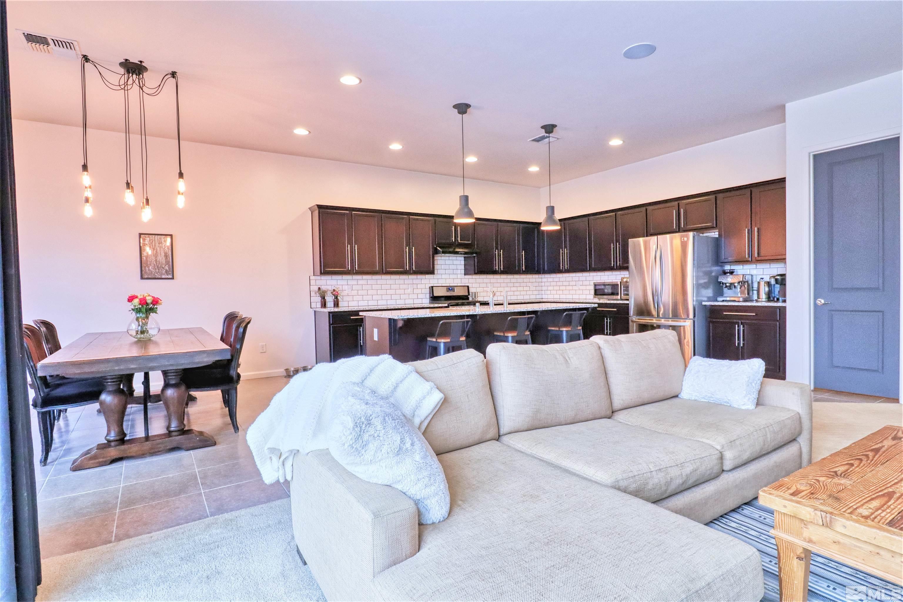 2790 Bonfire Lane Reno, NV 89521 - Photo 10 of 37 a living room with stainless steel appliances kitchen island granite countertop furniture and a view of kitchen