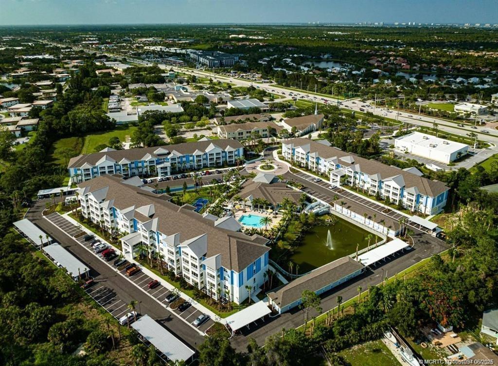 1924 Northwest Federal Highway, Unit 3201 Stuart, FL 34994 - Photo 14 of 16 an aerial view of residential building and lake