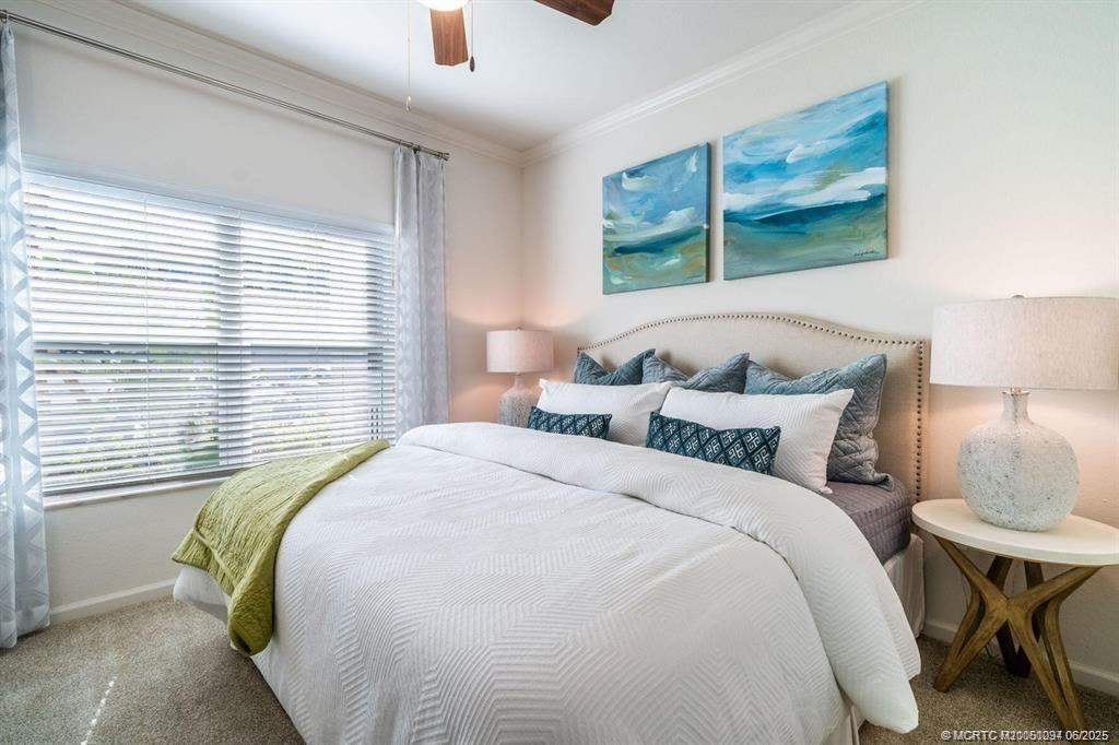 1924 Northwest Federal Highway, Unit 3201 Stuart, FL 34994 - Photo 7 of 16 a bedroom with bed and a window