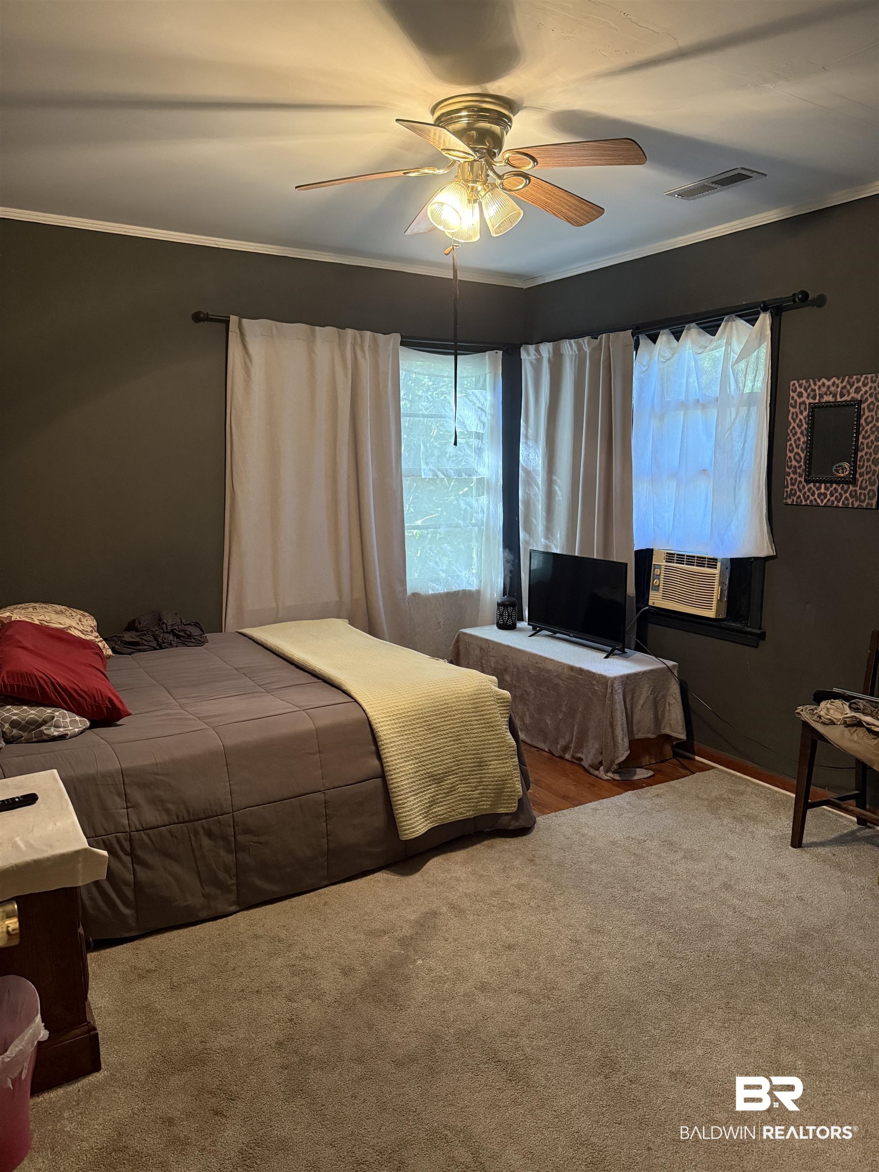 22173 1st Street Silverhill, AL 36576 - Photo 10 of 16 Bedroom with multiple windows, crown molding, a ceiling fan, carpet, and cooling unit