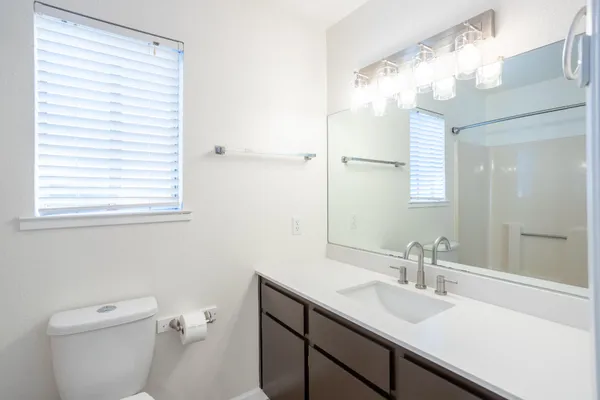 a bathroom with a sink and a toilet
