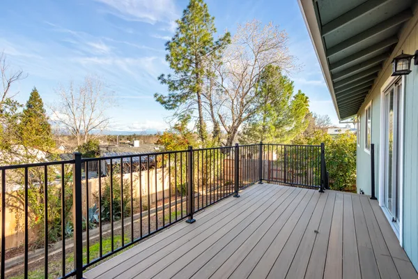 a view of deck with wooden floor and fence