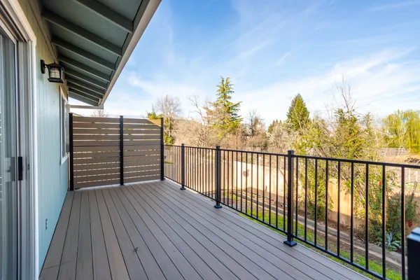 a view of a balcony with wooden floor
