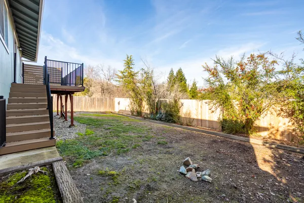 a backyard of a house with lots of green space