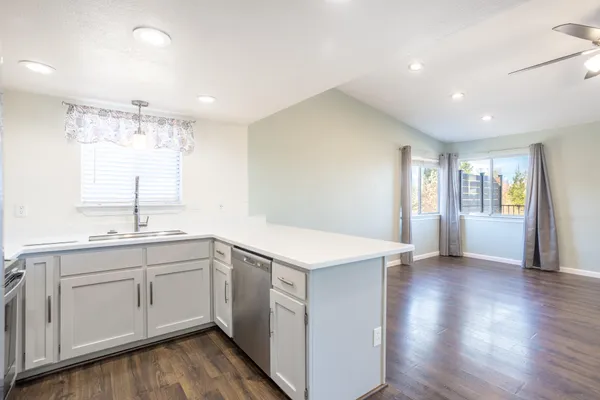 a kitchen with a sink and cabinets