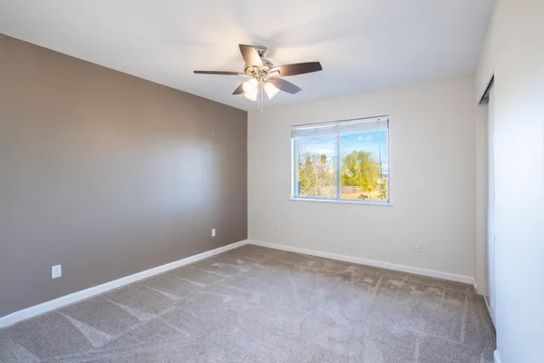 a view of an empty room with a window