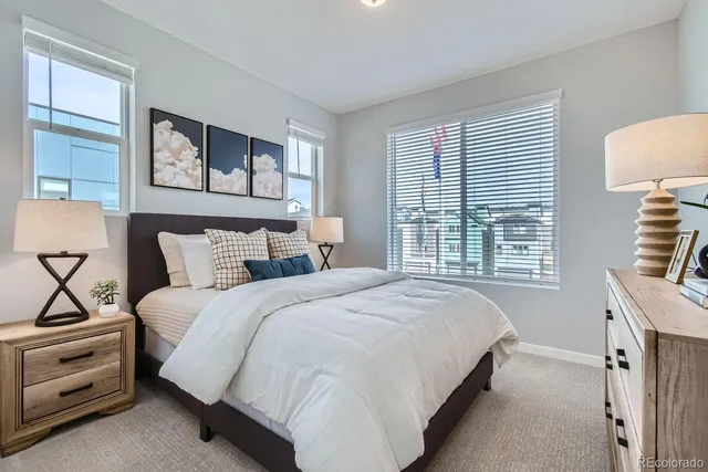 a bedroom with bed and a window