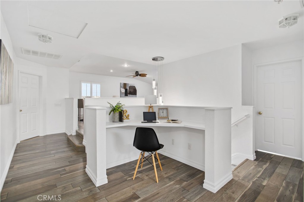 33686 Abbey Road Temecula, CA 92592 - Photo 15 of 37 a view of kitchen with wooden floor and chairs
