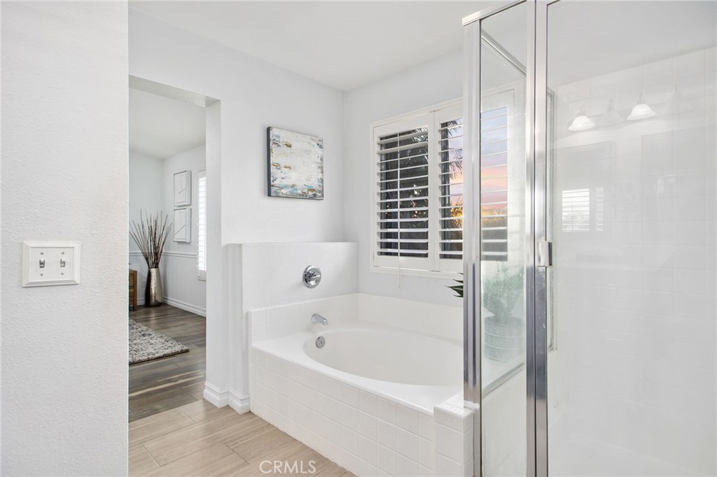 33686 Abbey Road Temecula, CA 92592 - Photo 23 of 37 a bathroom with a bathtub and a shower