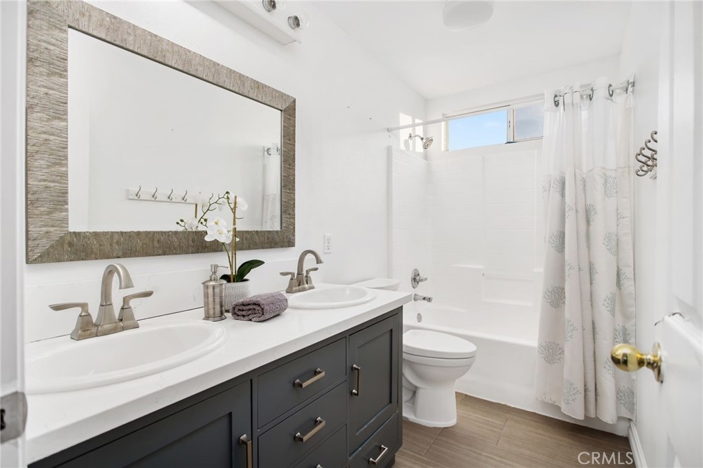 33686 Abbey Road Temecula, CA 92592 - Photo 28 of 37 a bathroom with a double vanity sink toilet and shower