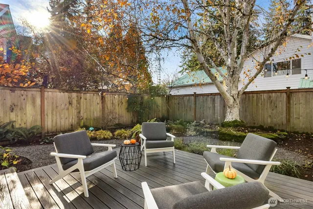 a backyard of a house with barbeque oven
