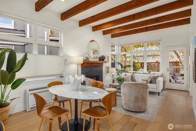 a outdoor dining space with furniture and wooden floor