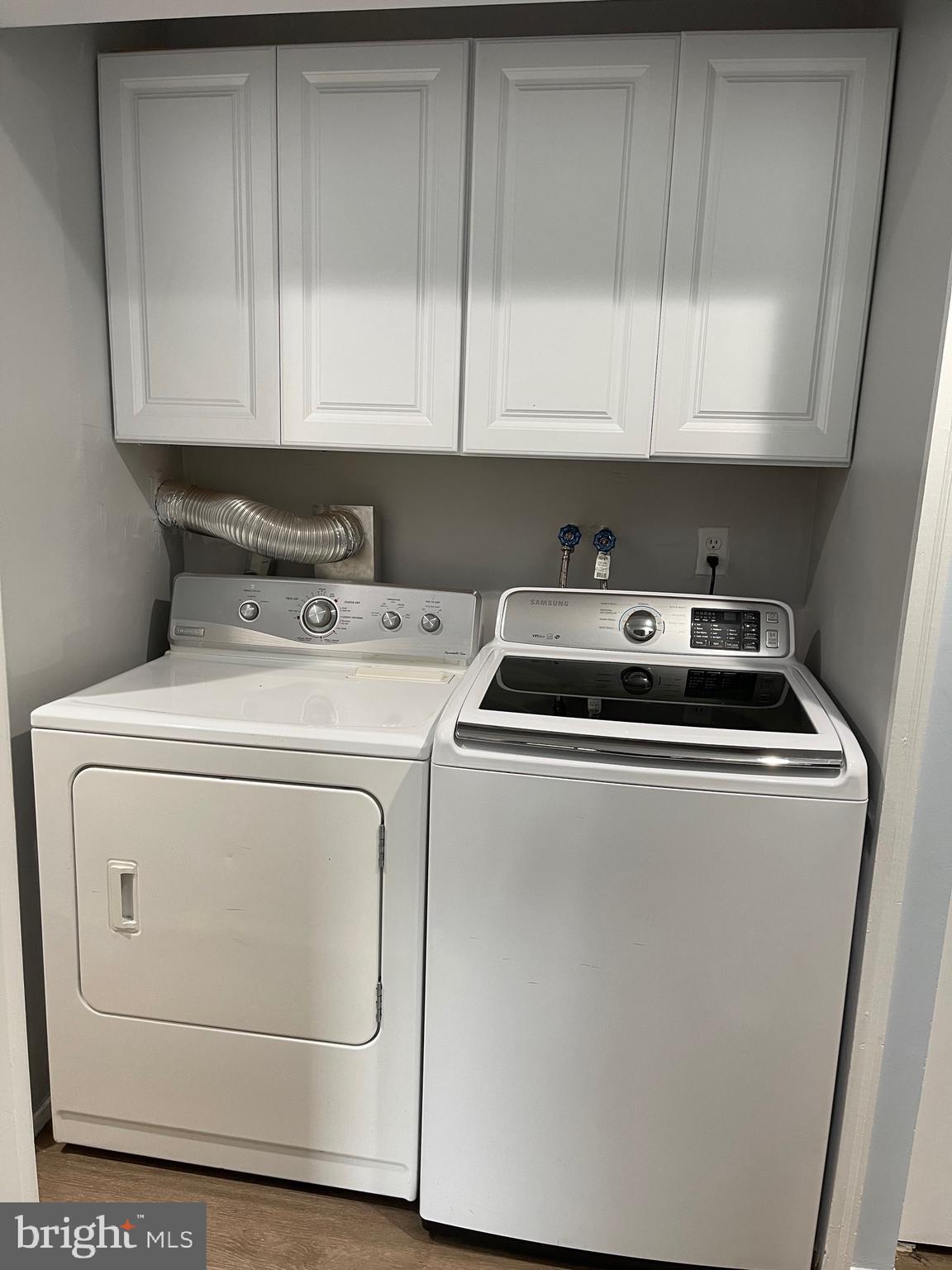 444 Girard Street, Unit 102 Gaithersburg, MD 20877 - Photo 11 of 30 a utility room with dryer and washer