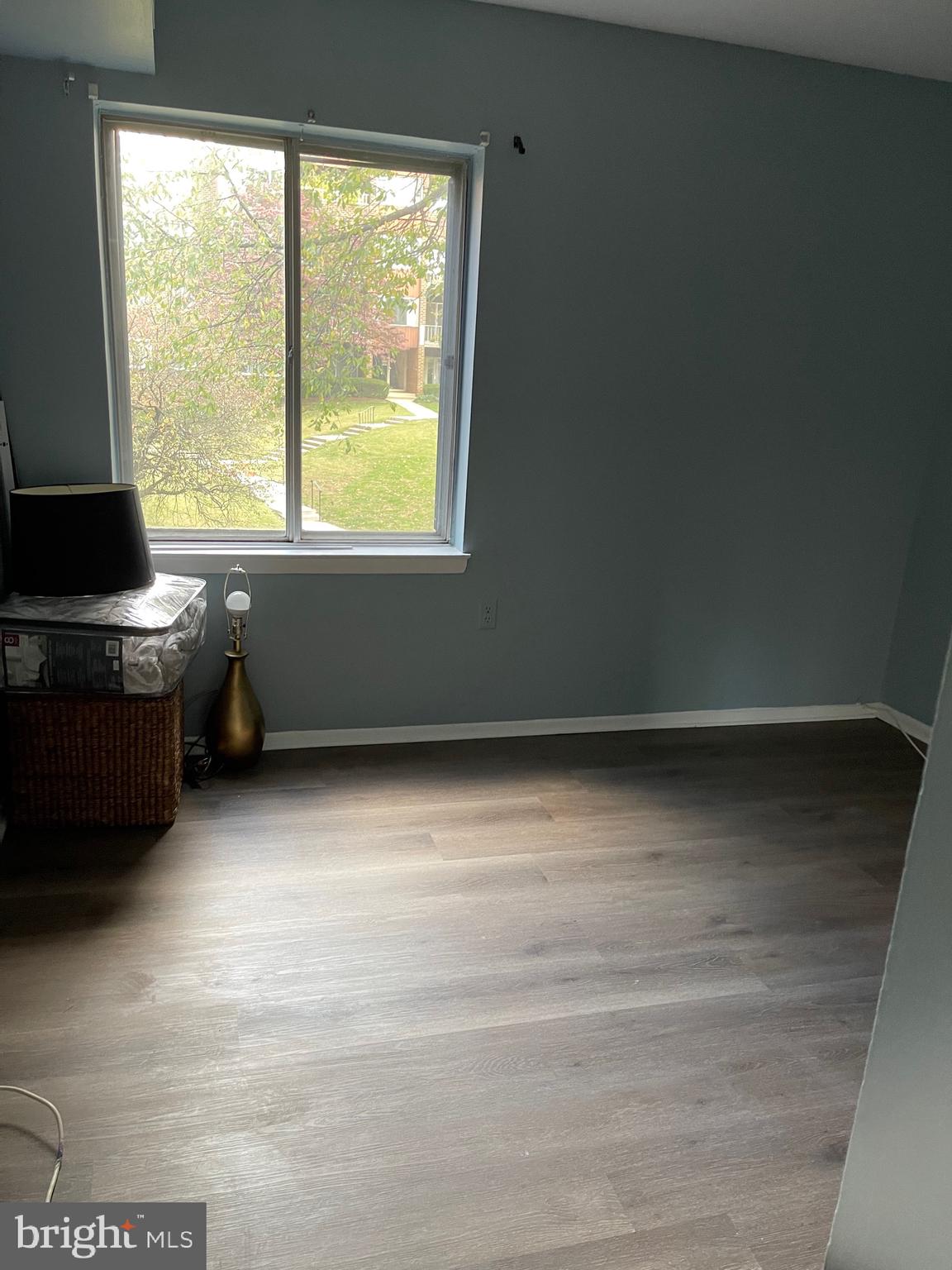 444 Girard Street, Unit 102 Gaithersburg, MD 20877 - Photo 12 of 30 a view of a livingroom with an empty space and a window