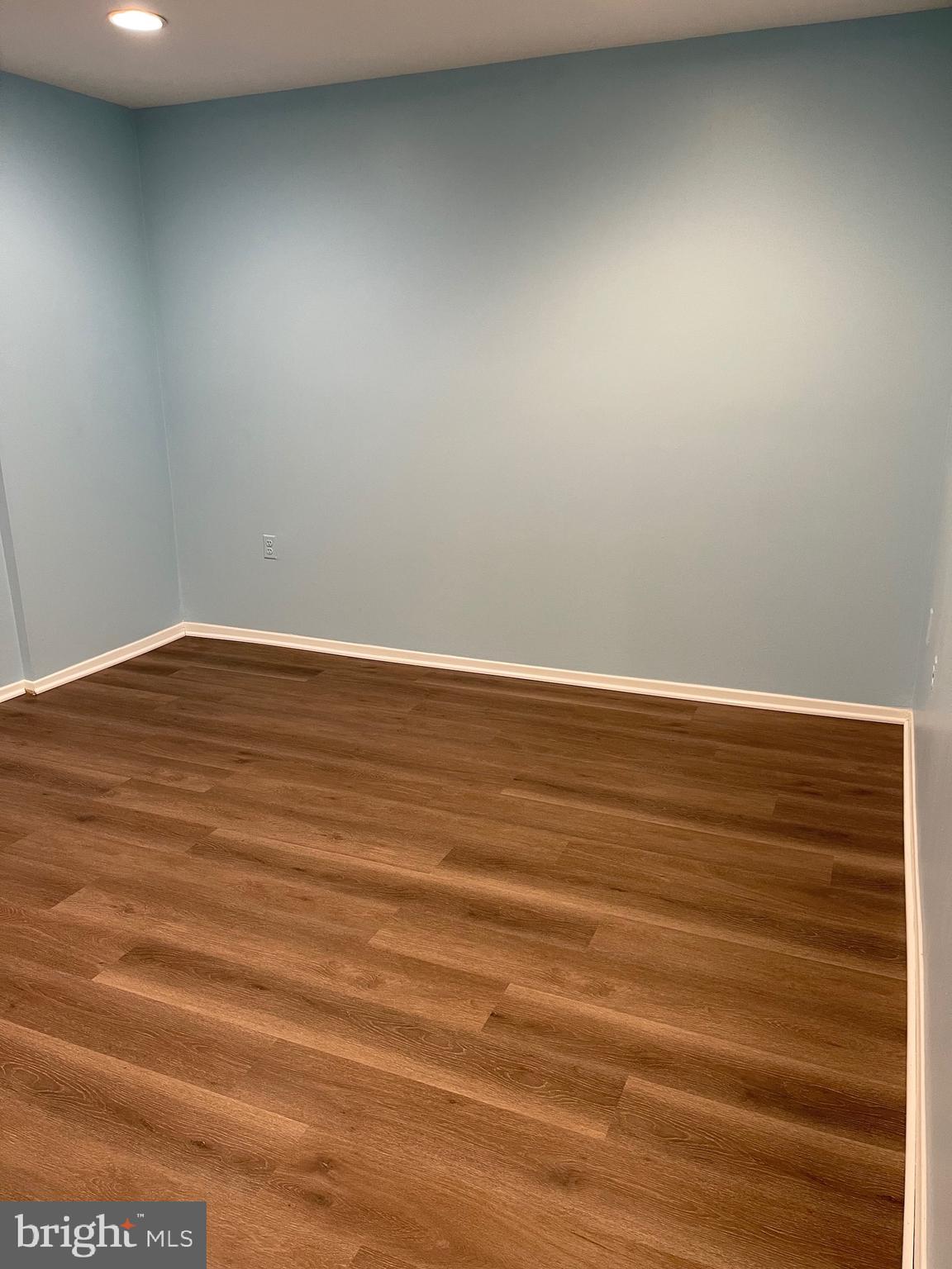 444 Girard Street, Unit 102 Gaithersburg, MD 20877 - Photo 2 of 30 a view of an empty room with wooden floor