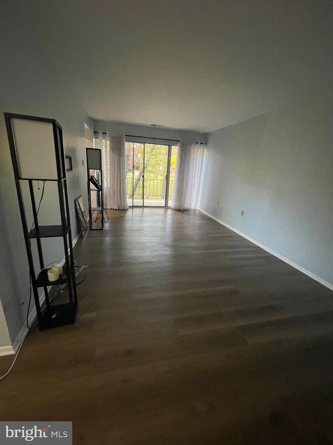 444 Girard Street, Unit 102 Gaithersburg, MD 20877 - Photo 27 of 30 wooden floor in an empty room with a window