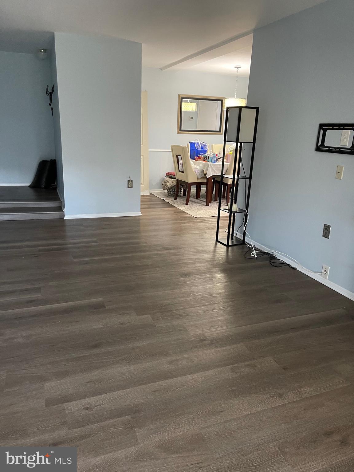 444 Girard Street, Unit 102 Gaithersburg, MD 20877 - Photo 29 of 30 a view of a workspace with furniture and wooden floor