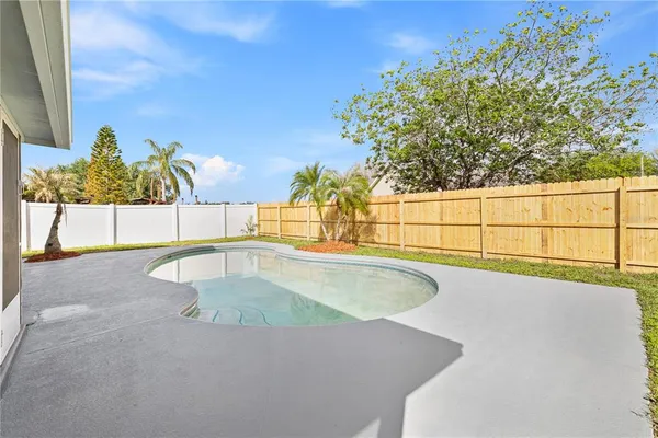 a view of outdoor space and swimming pool