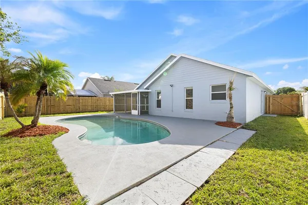 a house view with a backyard space
