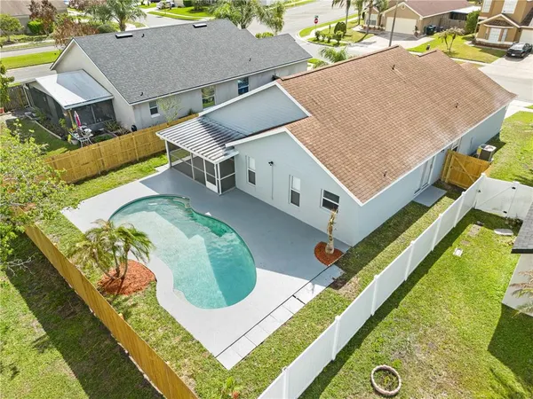 an aerial view of a house with swimming pool