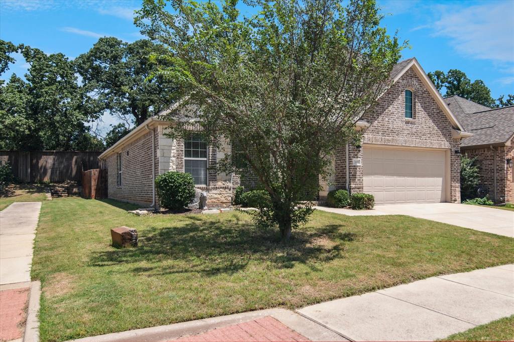 7401 Bishop Pine Road Denton, TX 76208 - Photo 2 of 25 a view of a yard in front of house
