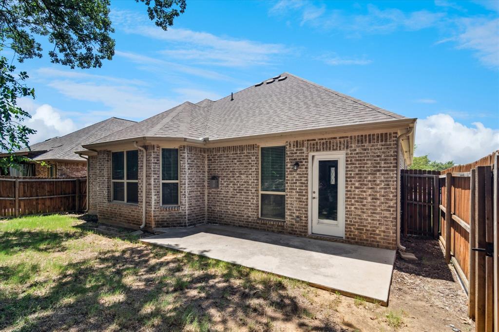 7401 Bishop Pine Road Denton, TX 76208 - Photo 24 of 25 a front view of a house with a garden