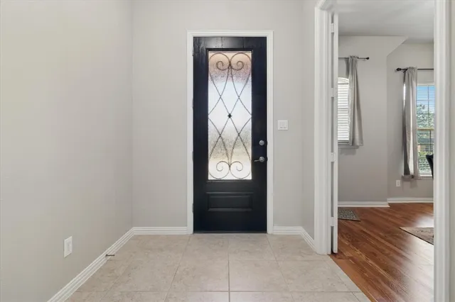 an empty room and closet with wooden floor