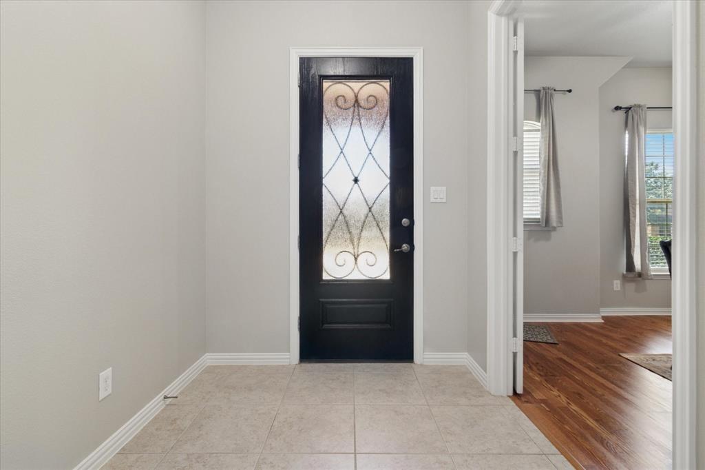 7401 Bishop Pine Road Denton, TX 76208 - Photo 3 of 25 an empty room and closet with wooden floor