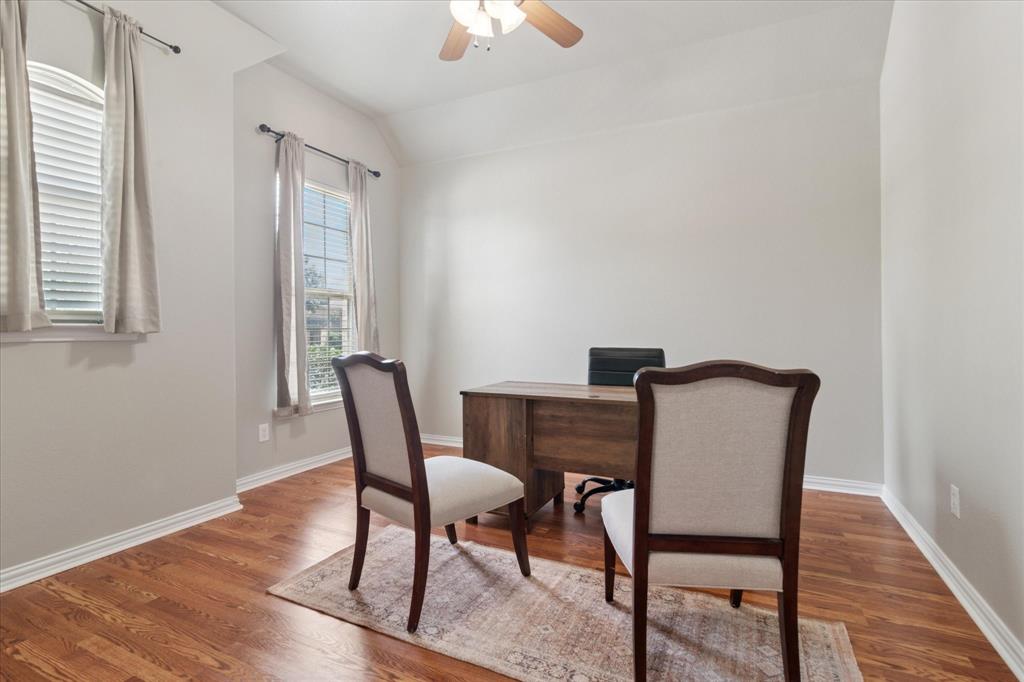 7401 Bishop Pine Road Denton, TX 76208 - Photo 10 of 25 a dining room with furniture and wooden floor