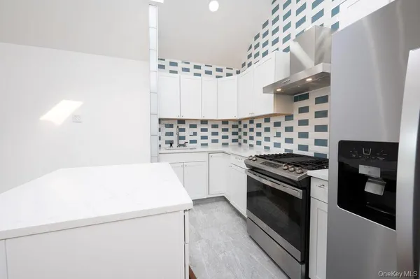 a kitchen with a stove and a microwave
