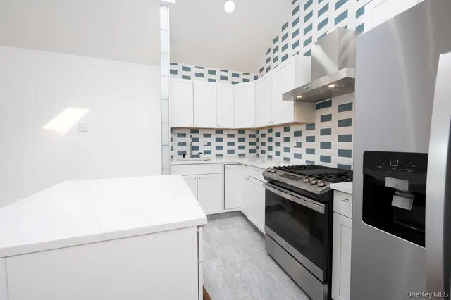 a kitchen with a stove and a microwave