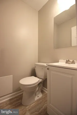 a bathroom with a toilet and a sink