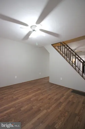 a view of an empty room with stairs