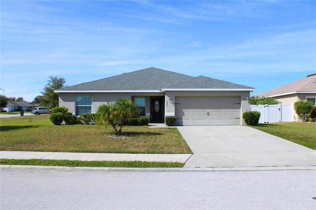 233 Cattail Way Lake Alfred, FL 33850 - Photo 1 of 25 a front view of a house with a yard