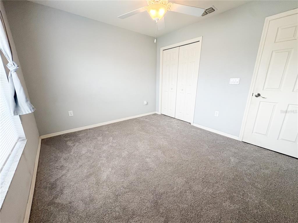 233 Cattail Way Lake Alfred, FL 33850 - Photo 16 of 25 an empty room with windows and entrance
