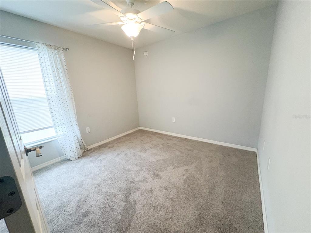 233 Cattail Way Lake Alfred, FL 33850 - Photo 17 of 25 an empty room with a window